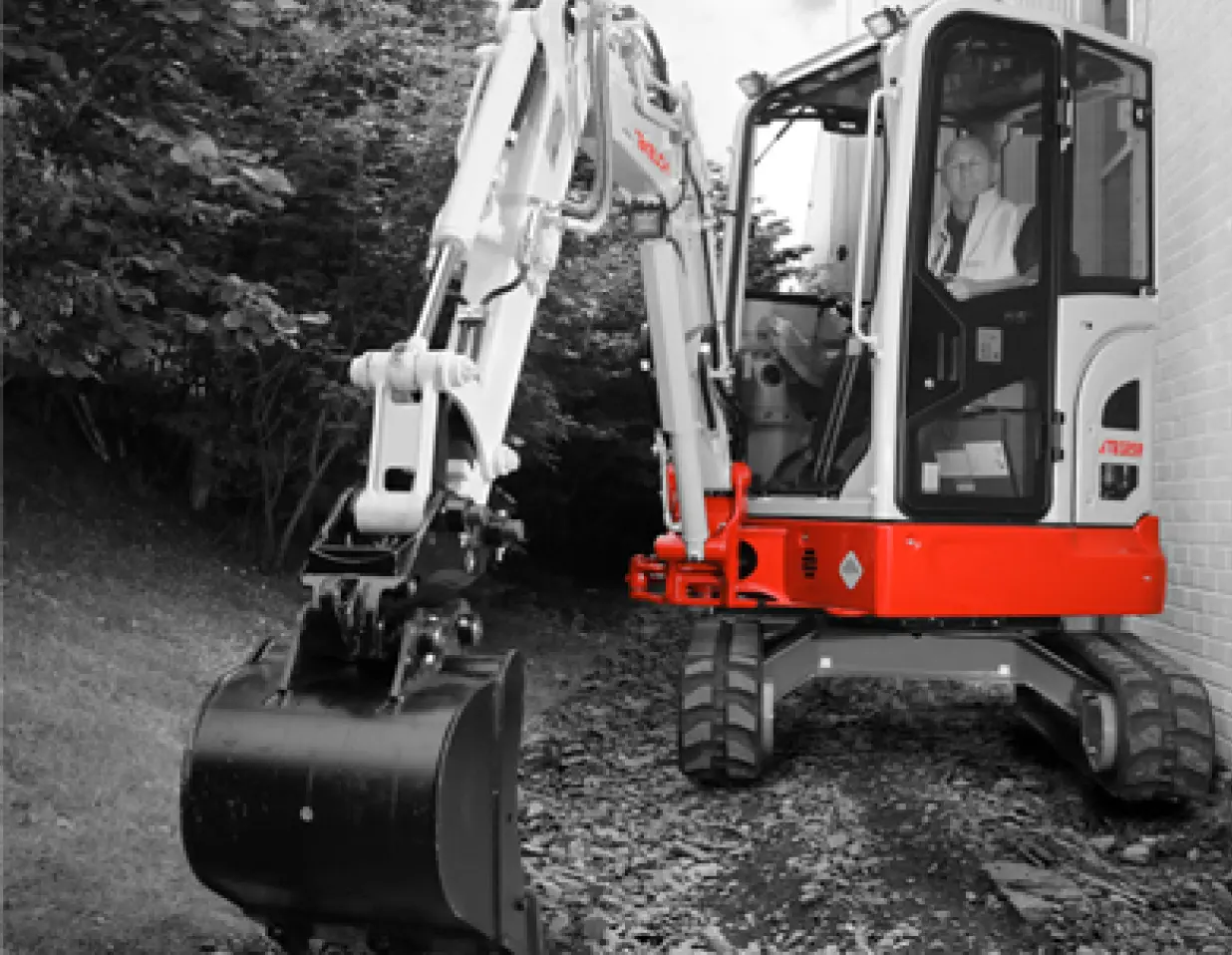Takeuchi TB325R 2.5 tonne digger working in a residential garden